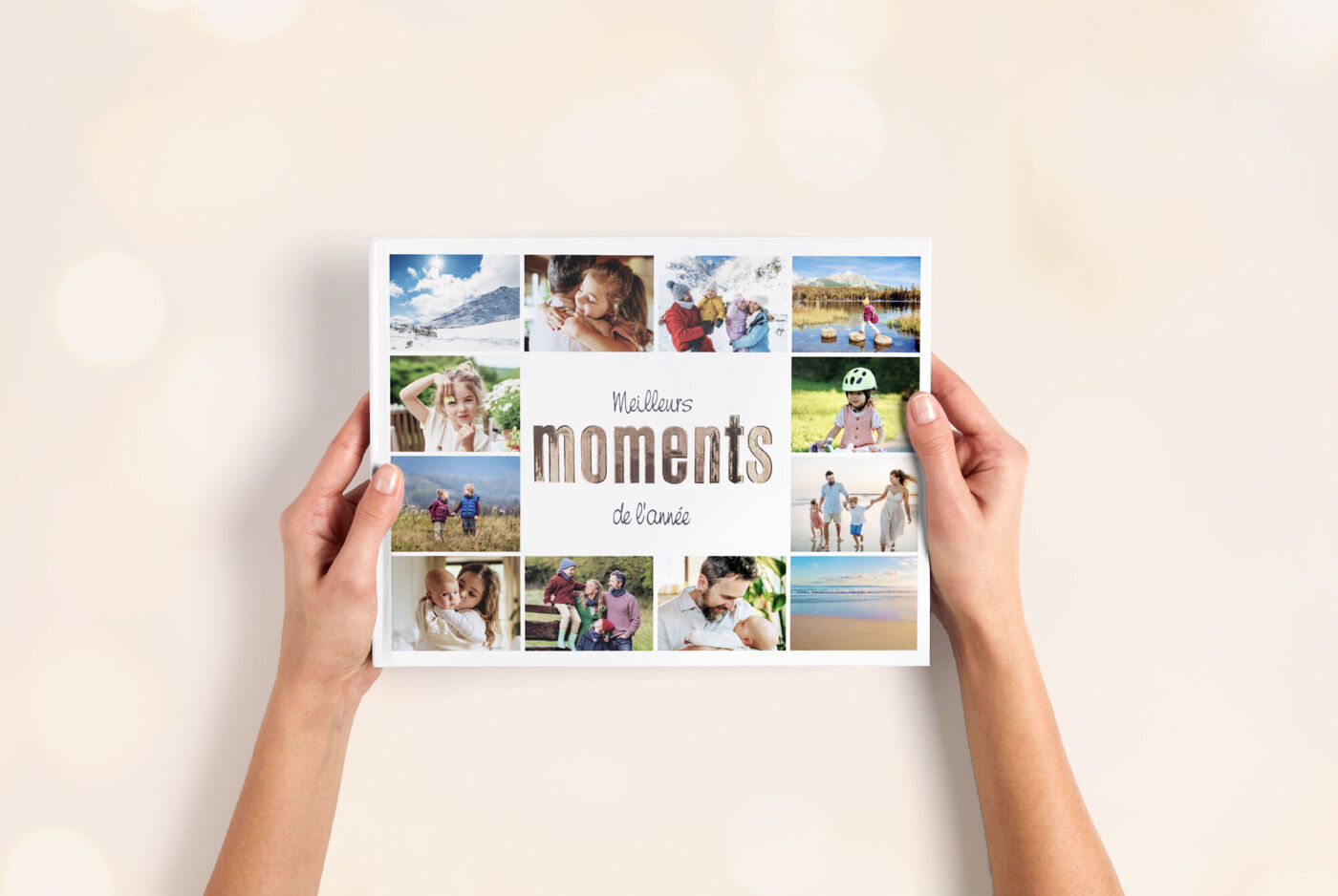 Une personne tient un album photo avec différentes photos de famille.