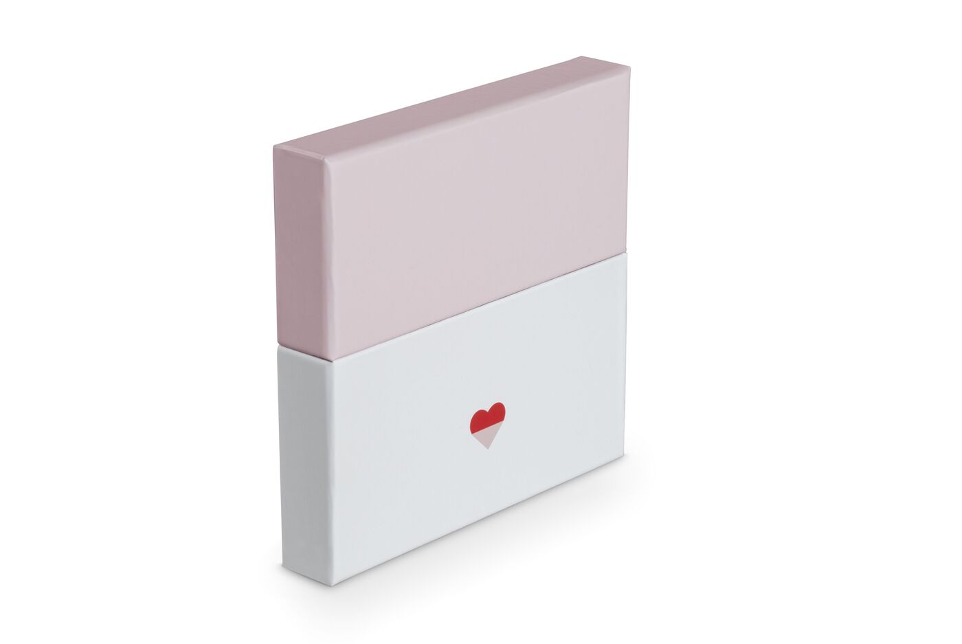 Cadeau merveilleux en rose et blanc avec un cœur rouge.